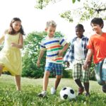 Kids Children Playing Football Fun Happiness Concept